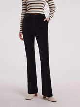 a woman in black pants